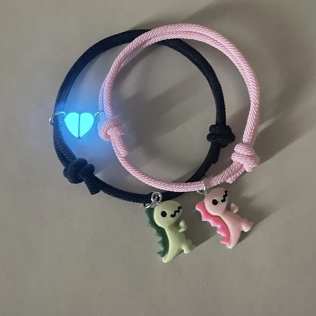 Couple Dinosaur Bracelets – 2-Piece Set, Luminous Peach Heart Pendants, Green and Pink Hand-Woven Bracelets
