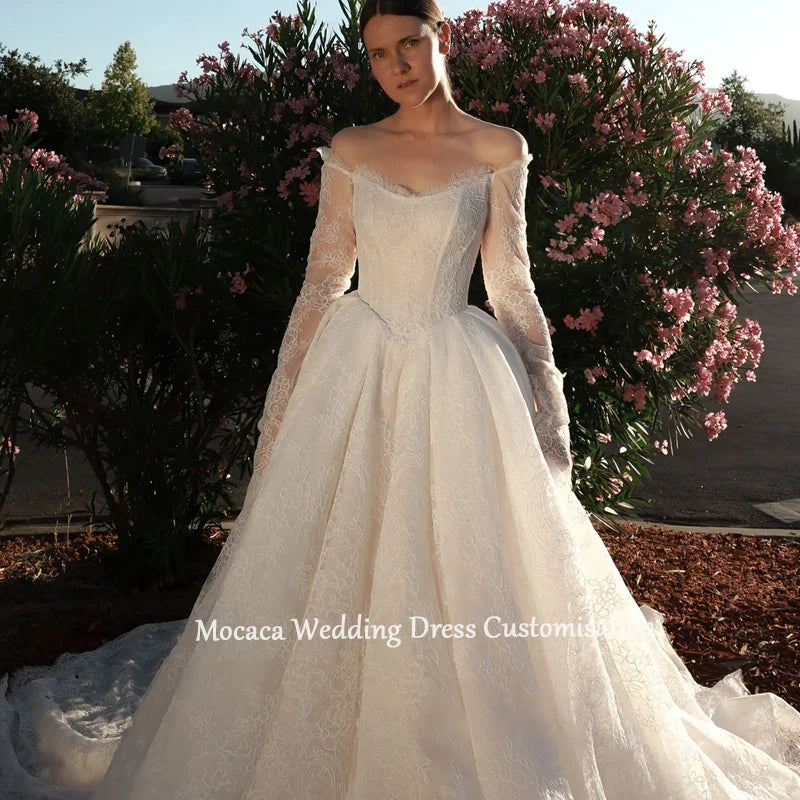 Mocaca 2026 Sweetheart Wedding Dress - Long-Sleeve Princess Gown with Glitter Detail & Court Train