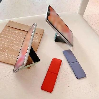 Folding Phone Stand - Self-Adhesive Desktop Sticky Back Phone Holder with Simple Push-Pull Design