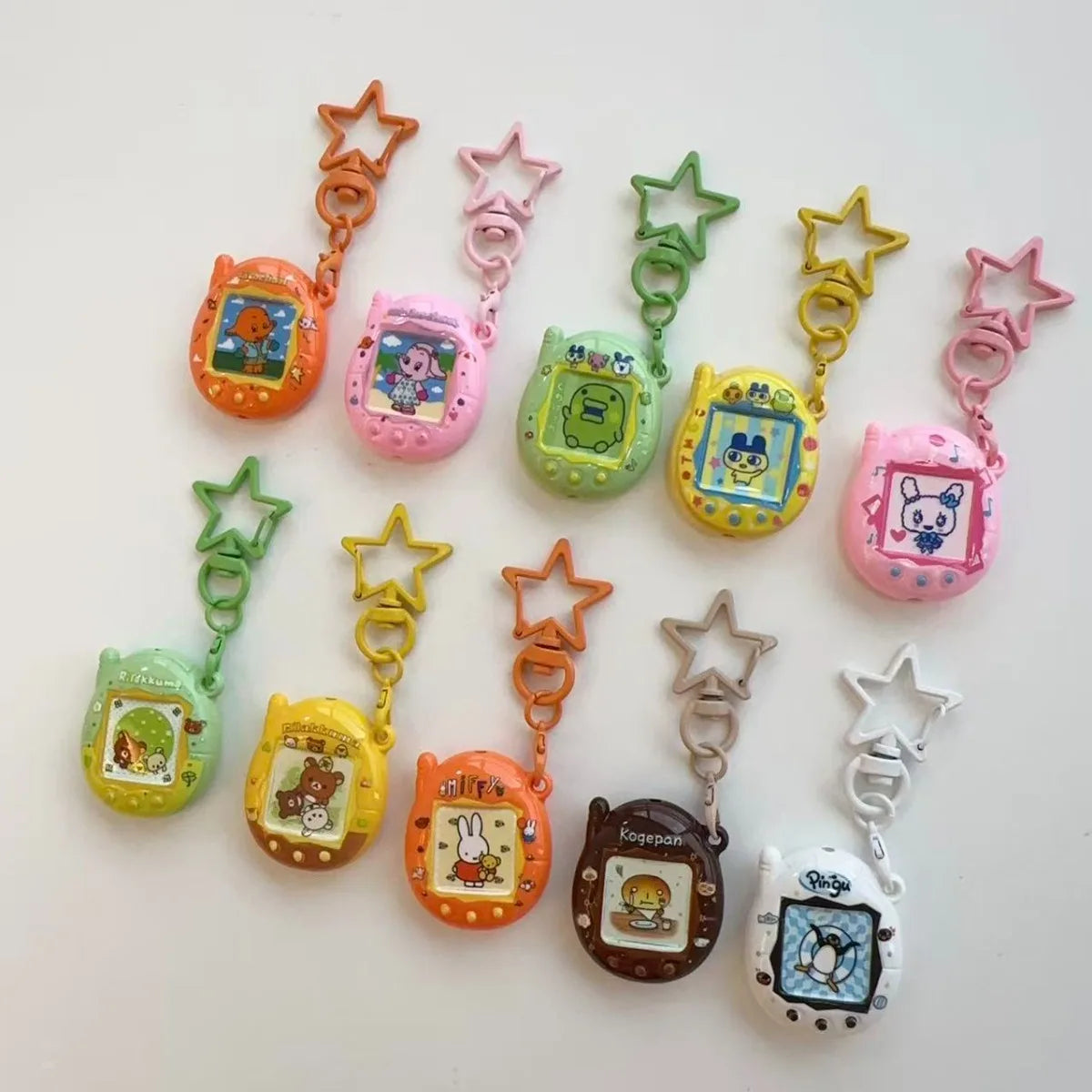 Tamagotchi Mini Cartoon Keychain - Cute Virtual Pet Pendant for Phones, Bags and Gaming Accessories
