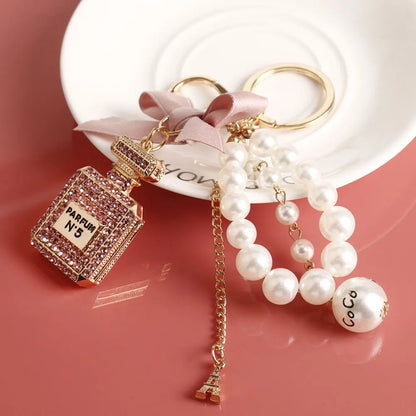 Fashion Pearl Perfume Bottle Keychain — Cute Bow Car & Bag Charm for Women, Creative Key Ring Accessory
