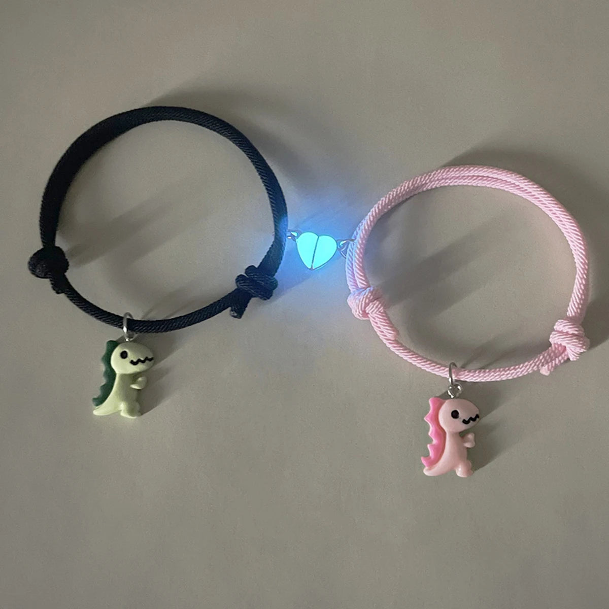 Couple Dinosaur Bracelets – 2-Piece Set, Luminous Peach Heart Pendants, Green and Pink Hand-Woven Bracelets