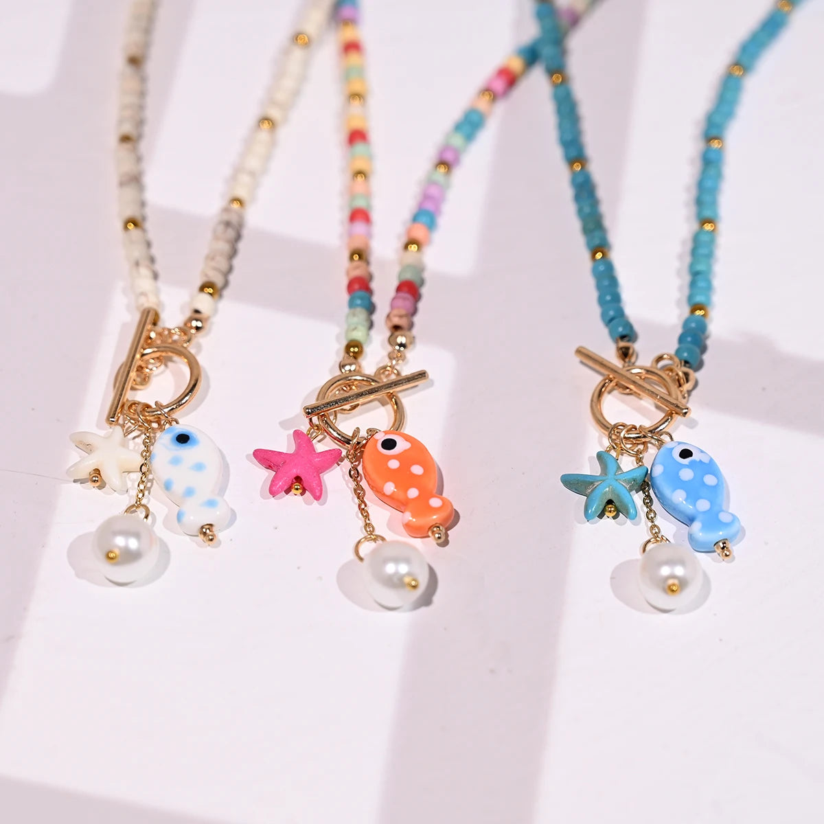 Bohemian Fish & Starfish Pendant Necklace - Sea-Inspired Ceramic Beach Jewelry with Synthetic Turquoise Beads