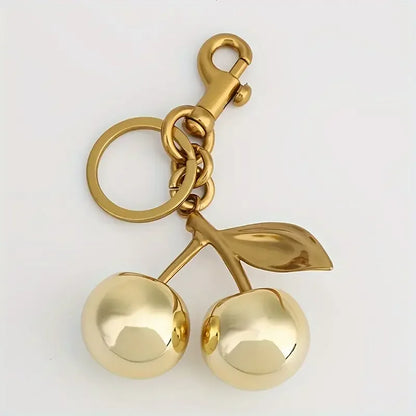 Golden Cherry Keychain Charm — Shiny Resin & Metal Bag Accessory, Elegant Gift for Women