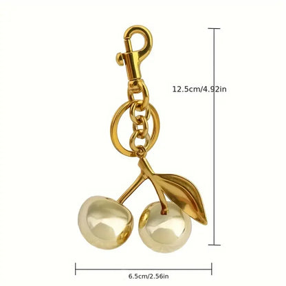 Golden Cherry Keychain Charm — Shiny Resin & Metal Bag Accessory, Elegant Gift for Women