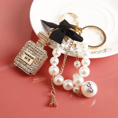 Fashion Pearl Perfume Bottle Keychain — Cute Bow Car & Bag Charm for Women, Creative Key Ring Accessory