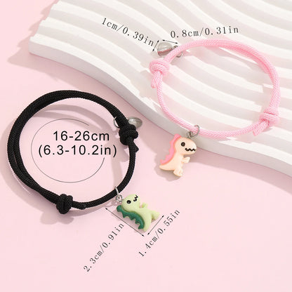 Couple Dinosaur Bracelets – 2-Piece Set, Luminous Peach Heart Pendants, Green and Pink Hand-Woven Bracelets