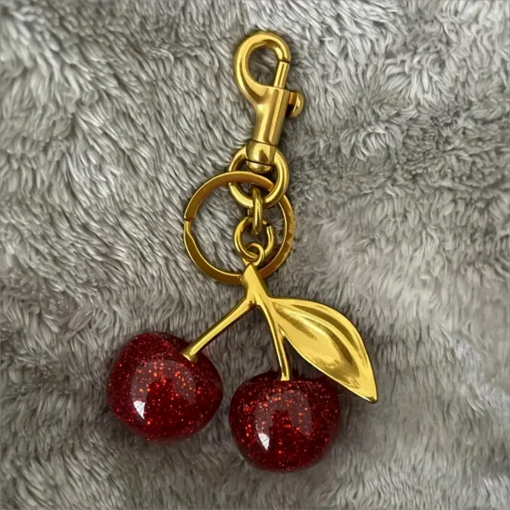 Golden Cherry Keychain Charm — Shiny Resin & Metal Bag Accessory, Elegant Gift for Women