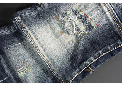 Streetwear Men’s Slim Fit Ripped Jeans – Retro Black & Blue Spliced Denim with Designer Embroidery, Hip Hop Fashion