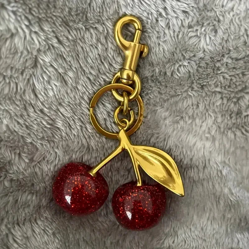 Golden Cherry Keychain Charm — Shiny Resin & Metal Bag Accessory, Elegant Gift for Women