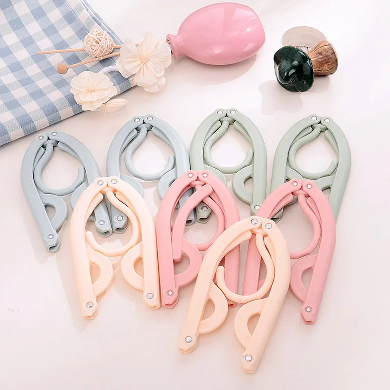 Space-Saving Foldable Plastic Clothes Hanger - Versatile, Creative, and Portable Clothing Support for Travel
