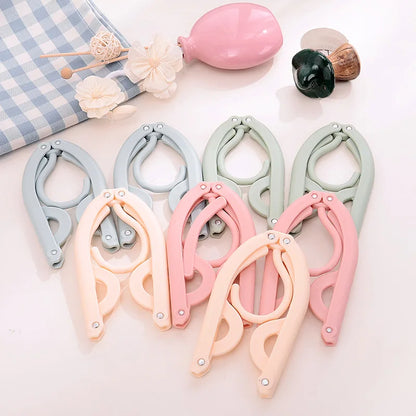Space-Saving Foldable Plastic Clothes Hanger - Versatile, Creative, and Portable Clothing Support for Travel