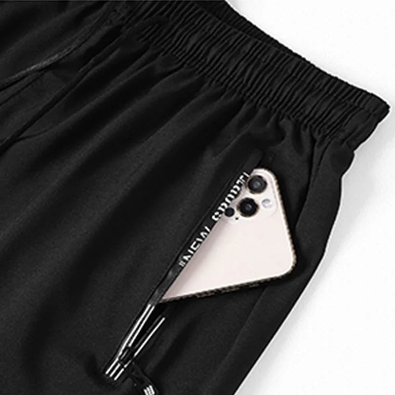 Men's Plus Size Sweatpants – 1/2/3 Pack Loose Fit Elastic Waist Sport Shorts for Running & Fitness (1XL-7XL)