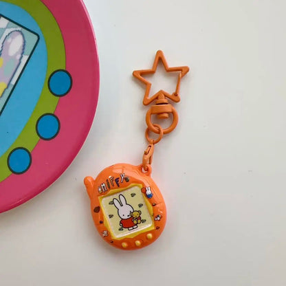 Tamagotchi Mini Cartoon Keychain - Cute Virtual Pet Pendant for Phones, Bags and Gaming Accessories