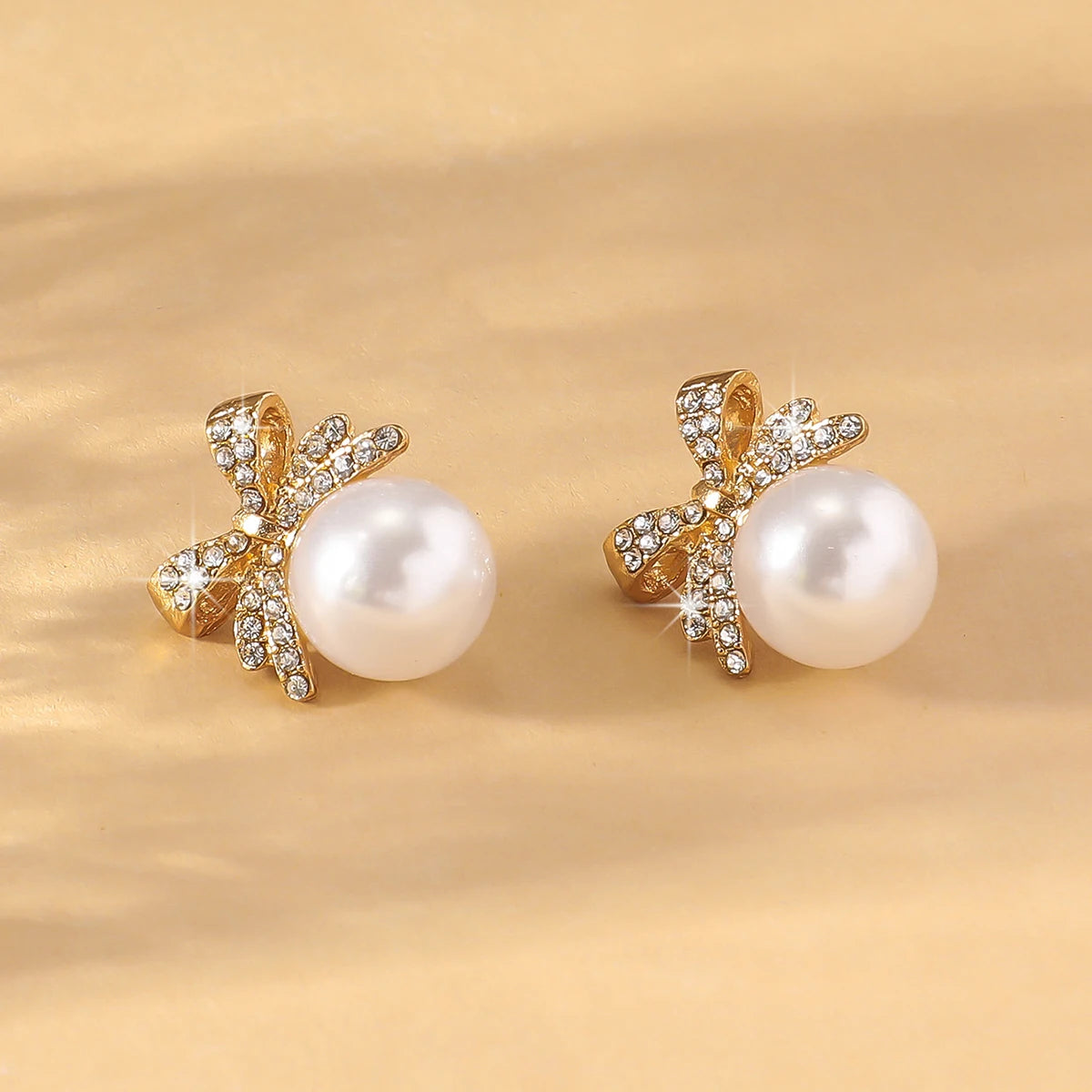 Women’s Silver Bow Earrings with Diamond Pearl – Fashionable High-End Studs