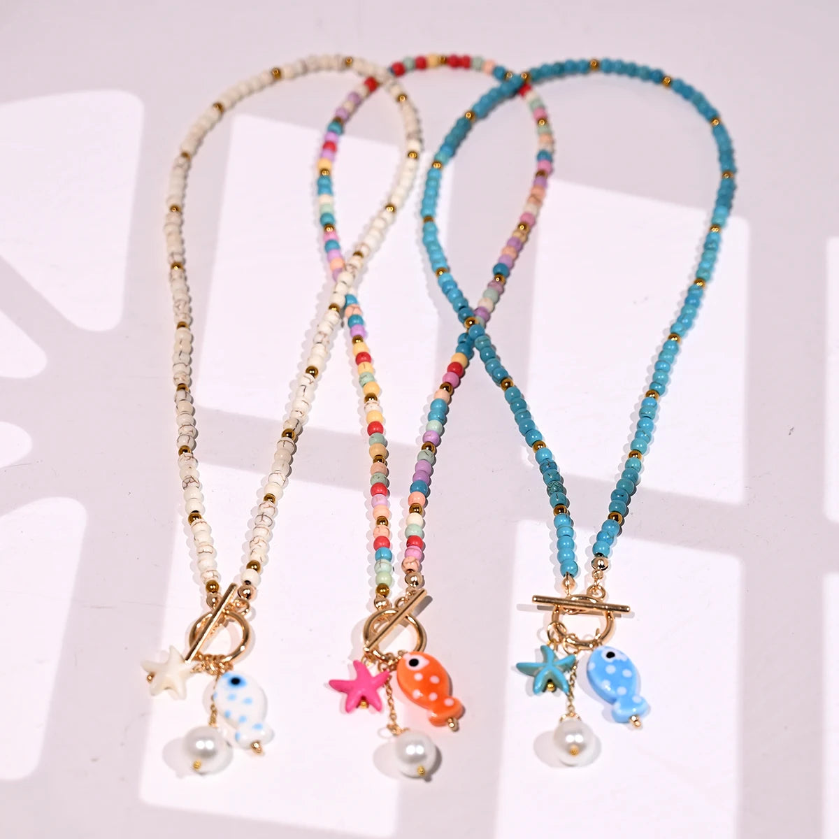 Bohemian Fish & Starfish Pendant Necklace - Sea-Inspired Ceramic Beach Jewelry with Synthetic Turquoise Beads