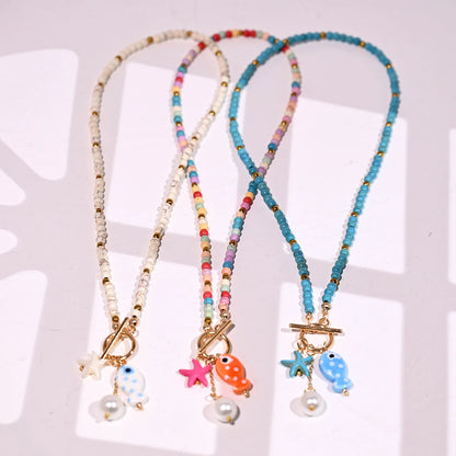 Bohemian Fish & Starfish Pendant Necklace - Sea-Inspired Ceramic Beach Jewelry with Synthetic Turquoise Beads