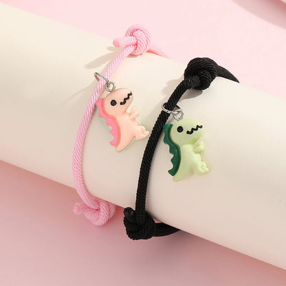 Couple Dinosaur Bracelets – 2-Piece Set, Luminous Peach Heart Pendants, Green and Pink Hand-Woven Bracelets